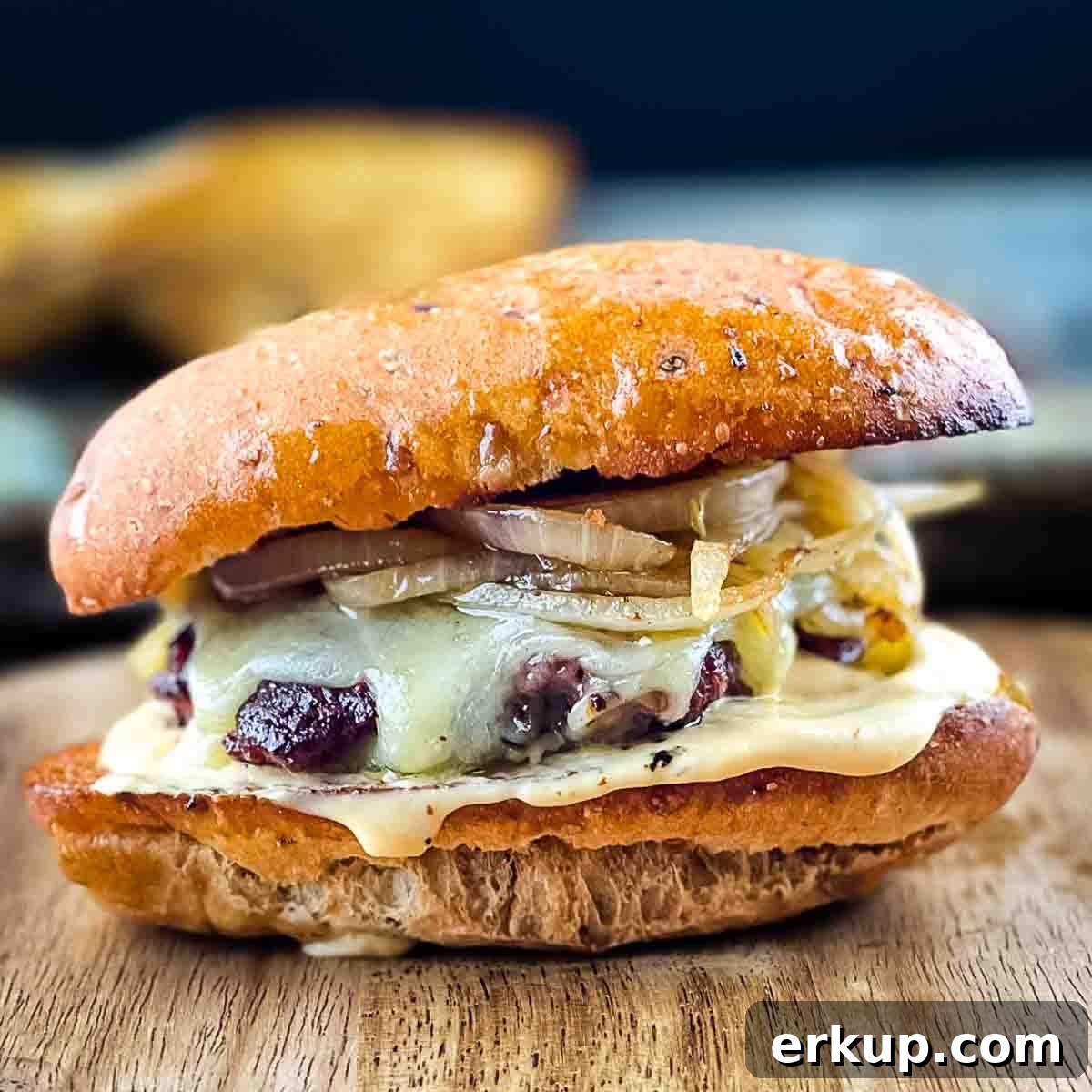 Perfect smash burger in a toasted bun with cheese, burger sauce, and fried onions.
