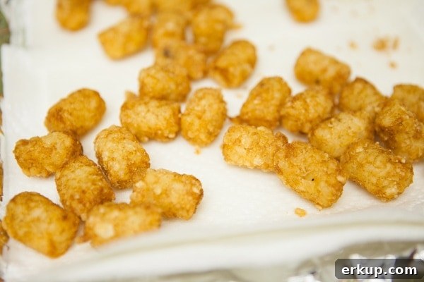 Totchos from The Little Kitchen Draining tater tots