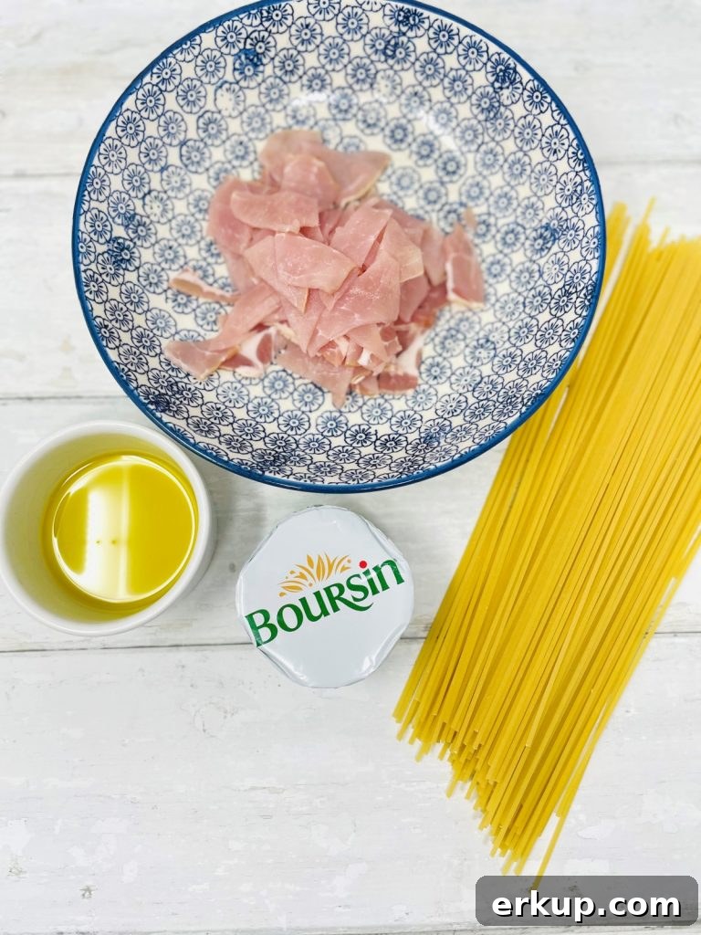 Ingredients for creamy bacon pasta including; chopped bacon, olive oil, spaghetti, boursin