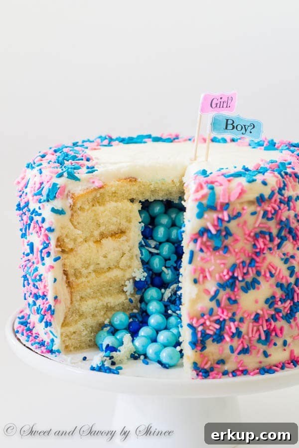 Tall 6-layer white cake covered with sweet and tangy cream cheese frosting and filled with colorful candies and sprinkles inside. Deliciously fun way to reveal the gender of a new bundle of joy!