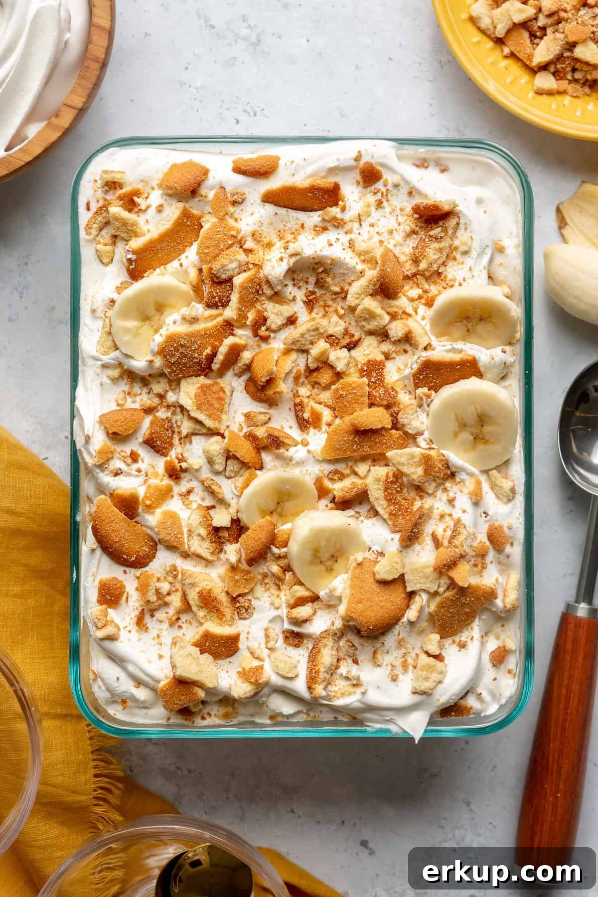 Dish of banana pudding ice cream topped with crushed vanilla wafers. 