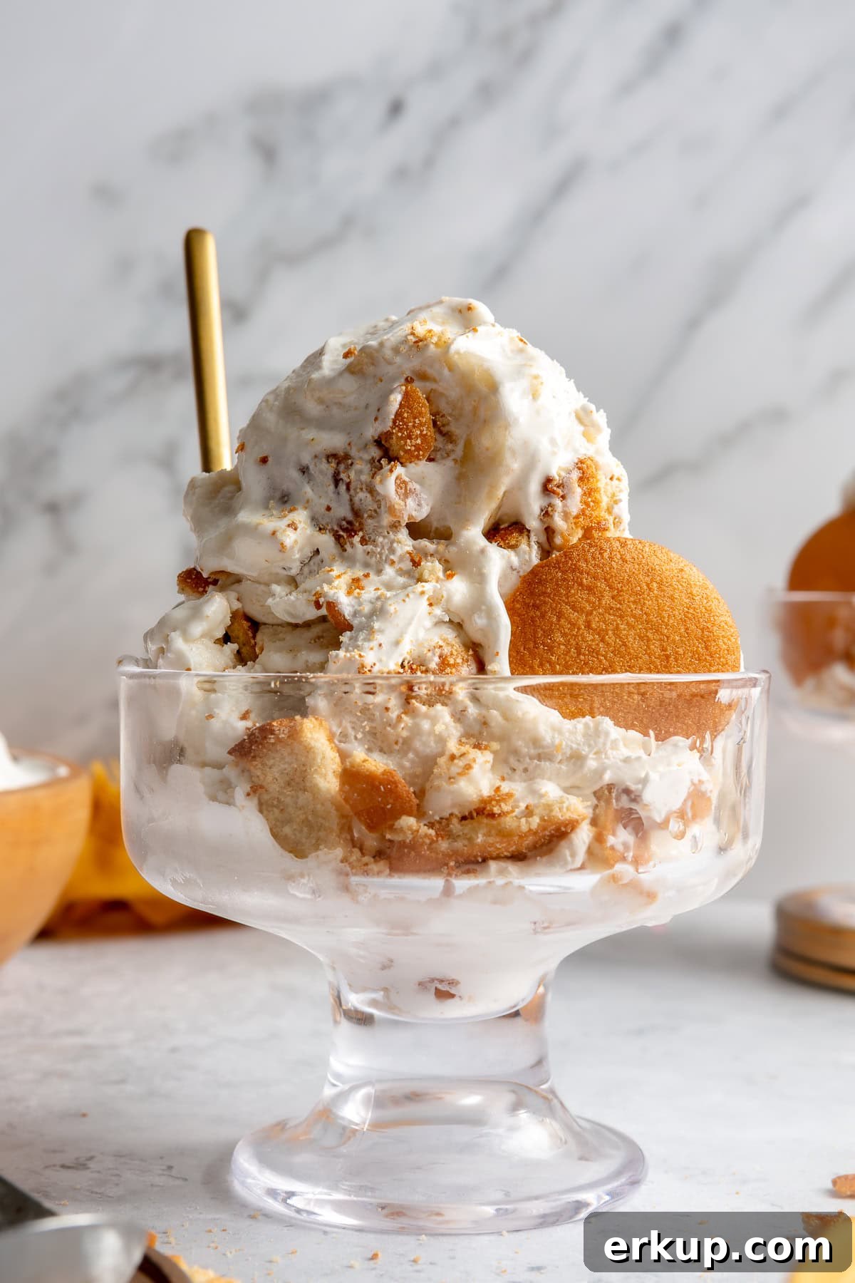 Banana pudding ice cream served in a glass dish.