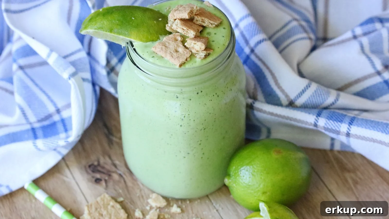 Featured image: a green smoothing in a clear glass jar with limes