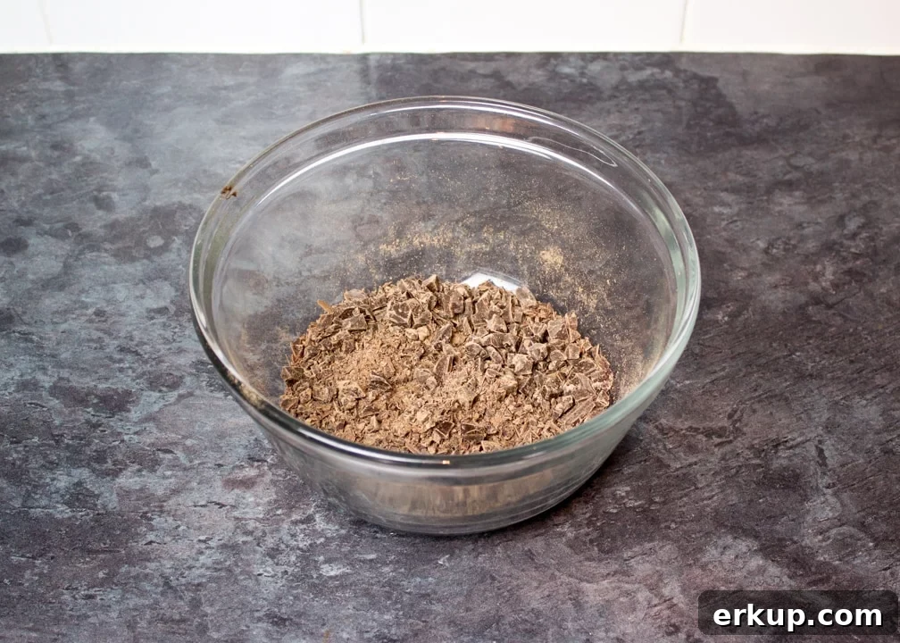 finely chopped dark chocolate in a glass bowl
