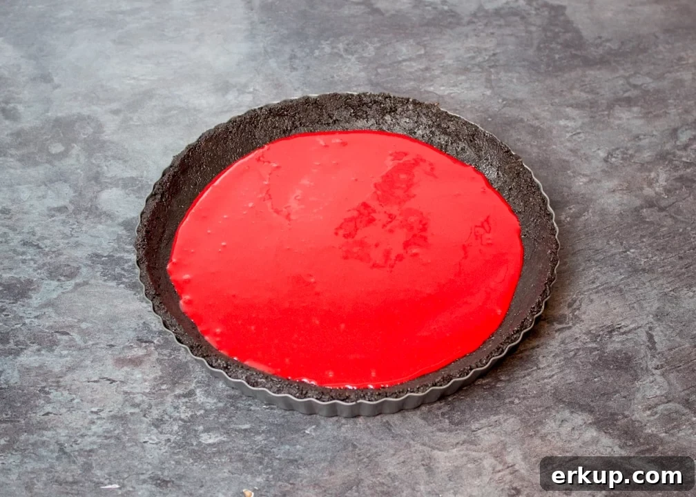 Red caramel in an Oreo crust in a fluted tin