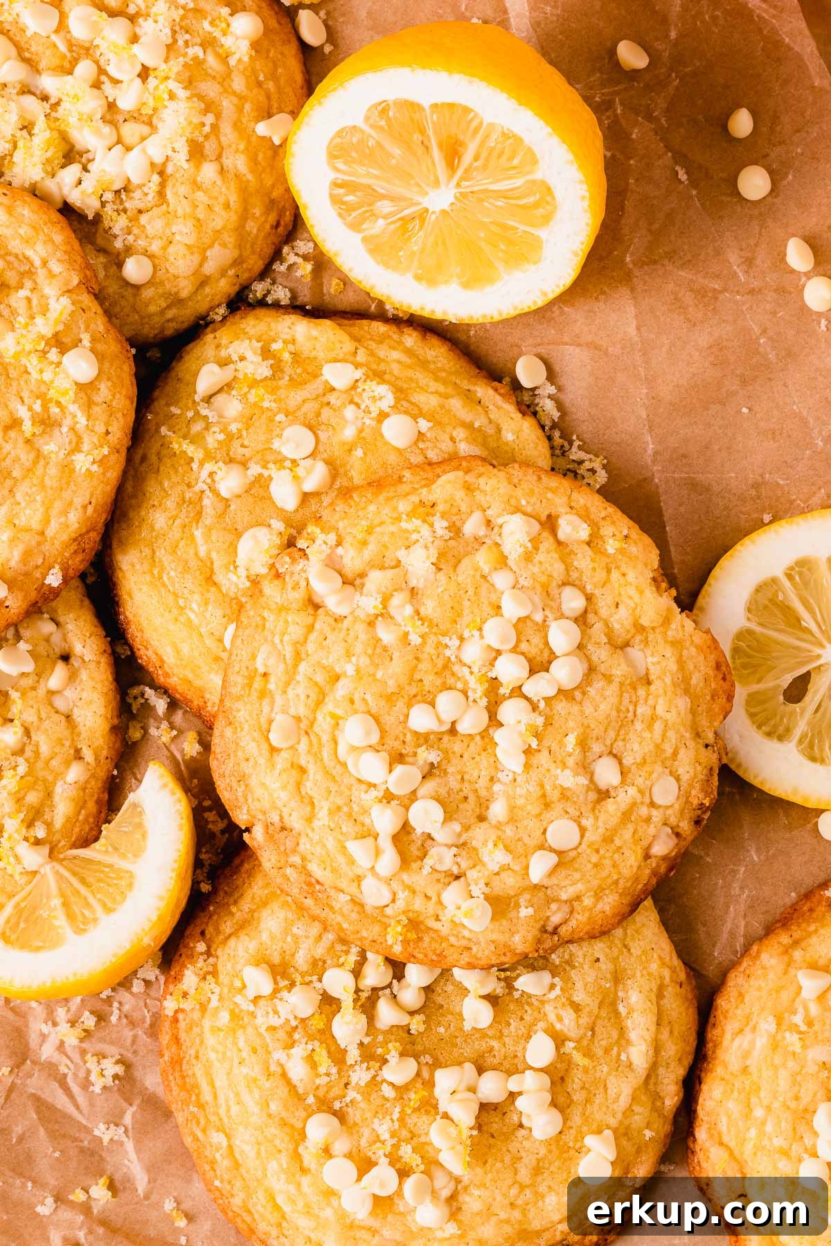 Zesty Lemon White Chocolate Cookies Recipe 12 lemon white chocolate cookies with mini white chocolate chips on parchment paper