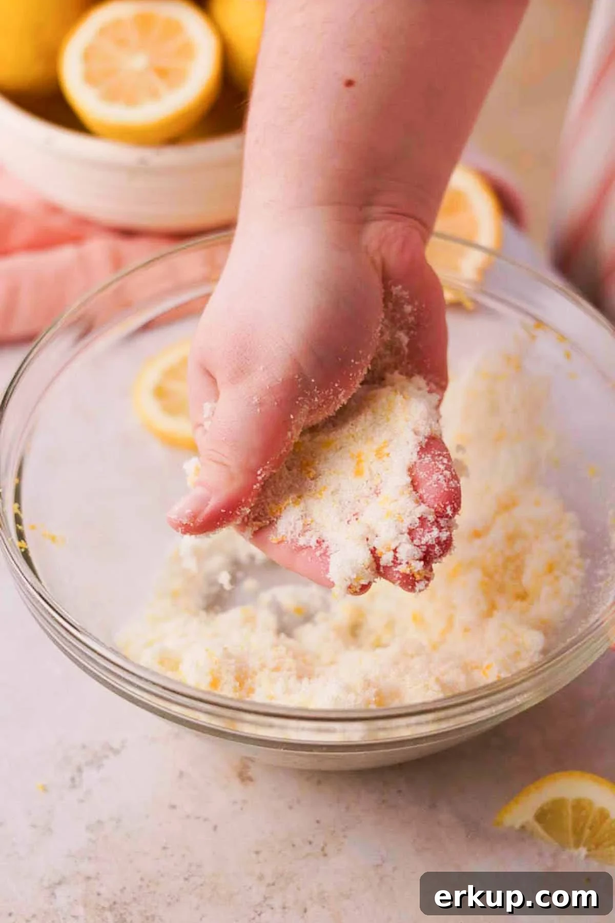 Zesty Lemon White Chocolate Cookies Recipe 5 rubbing lemon zest and sugar together with fingers in a large glass bowl