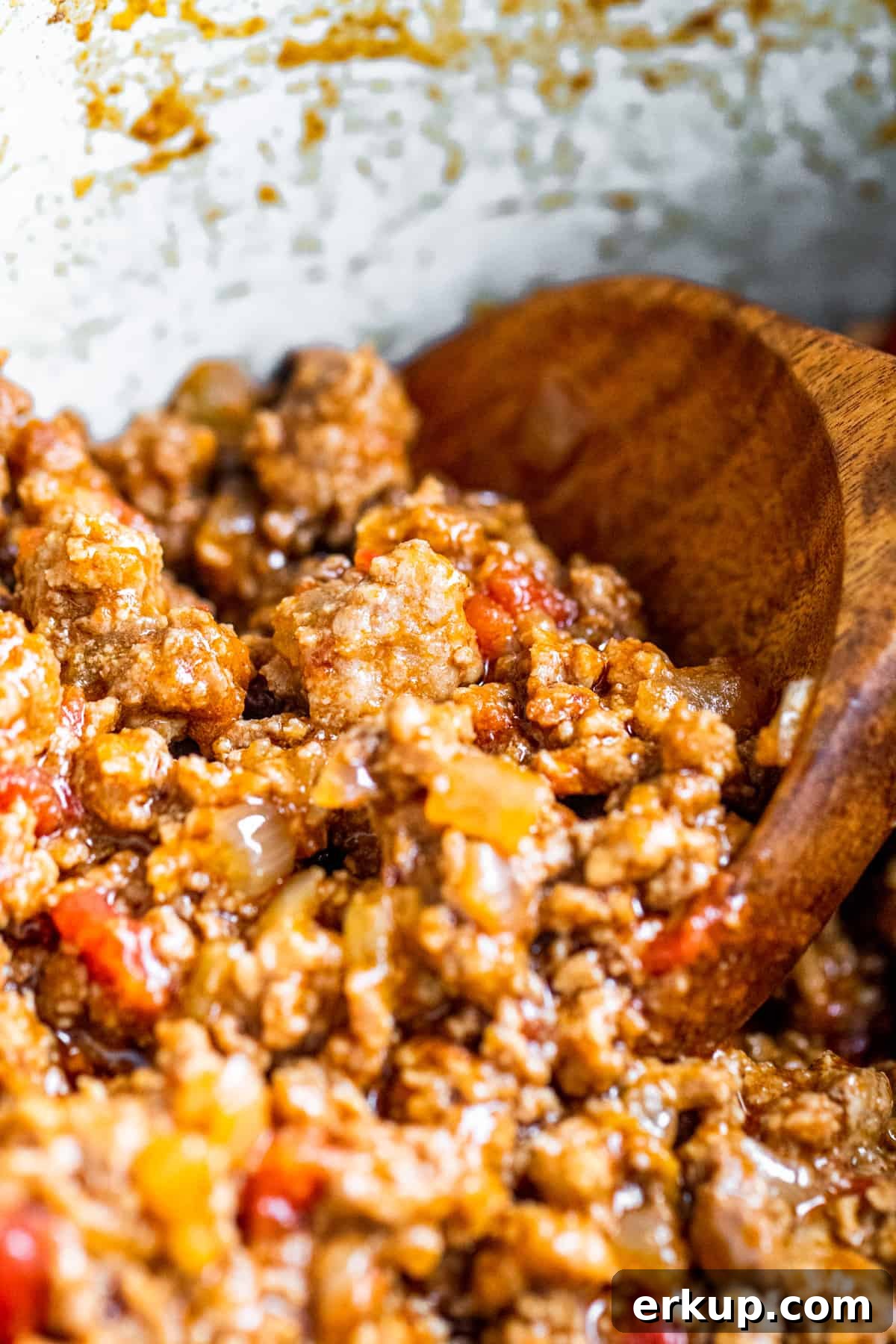 Wooden spoon in taco meat.