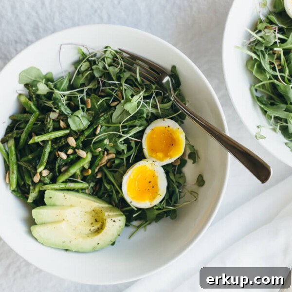 Arugula, asparagus and avocado breakfast salad