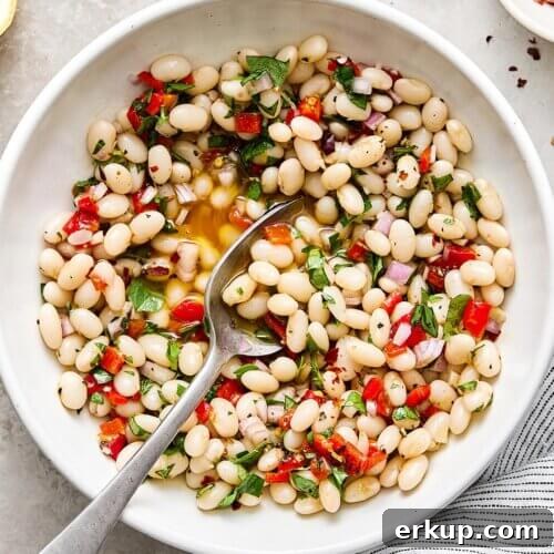 A bowl of marinated white beans.